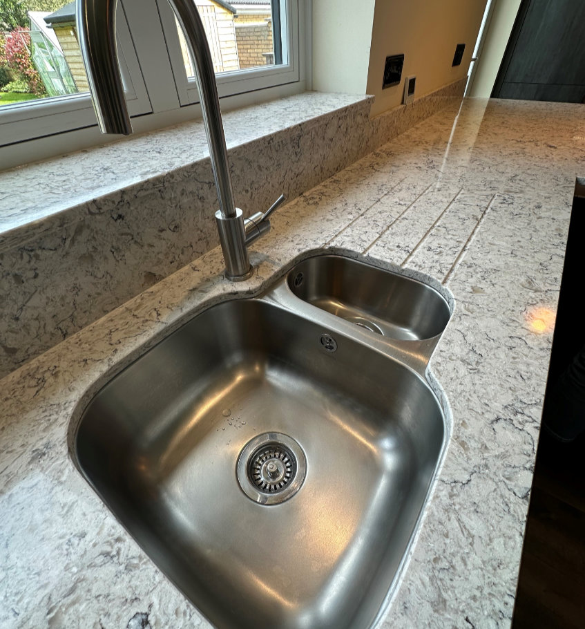 picture of a sink installation with a quartz worktop